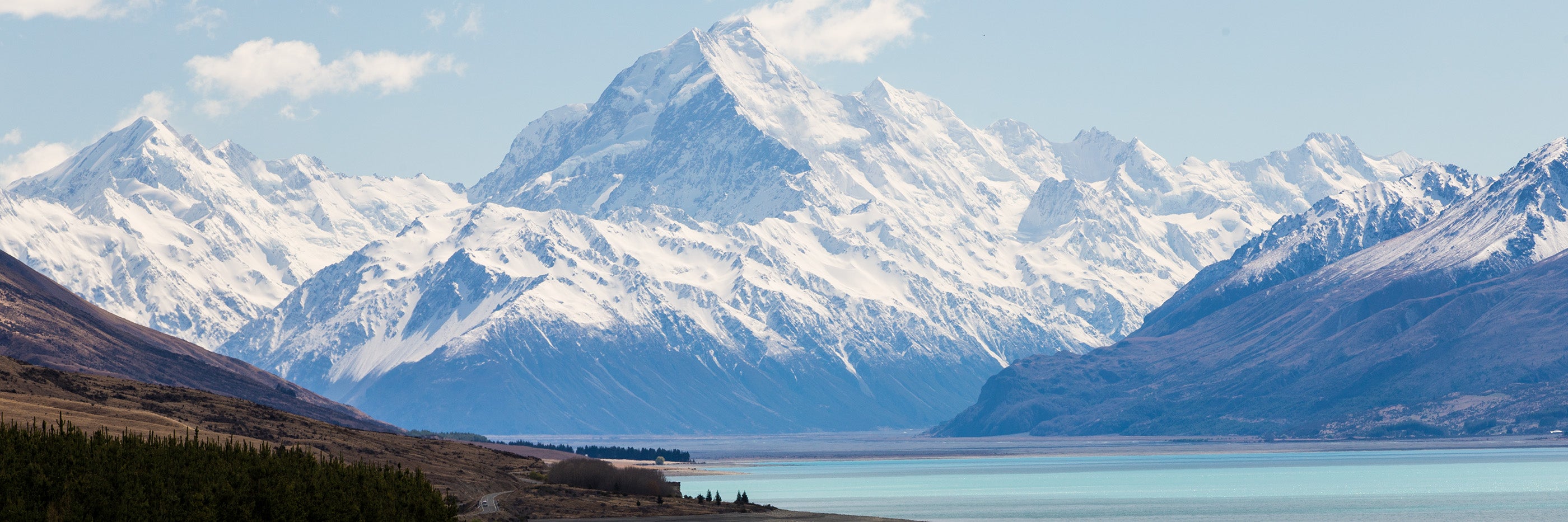 Snow-covered Southern Alps and Aoraki Mount Cook above Lake Pukaki, New Zealand