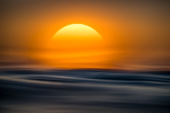 Ocean, sun rising over horizon reflecting across calm sea, landscape photography – Sean Scott Photography