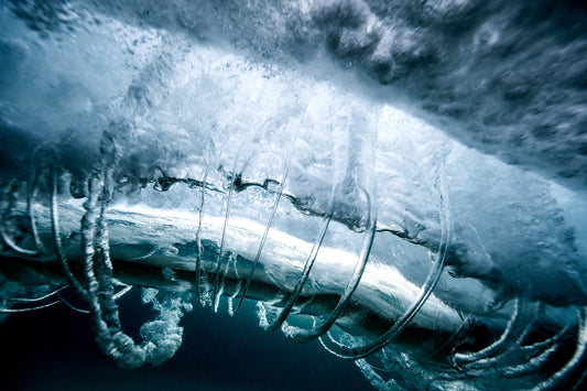Ocean underwater, dramatic wave textures in deep blue tones, underwater photography – Sean Scott Photography