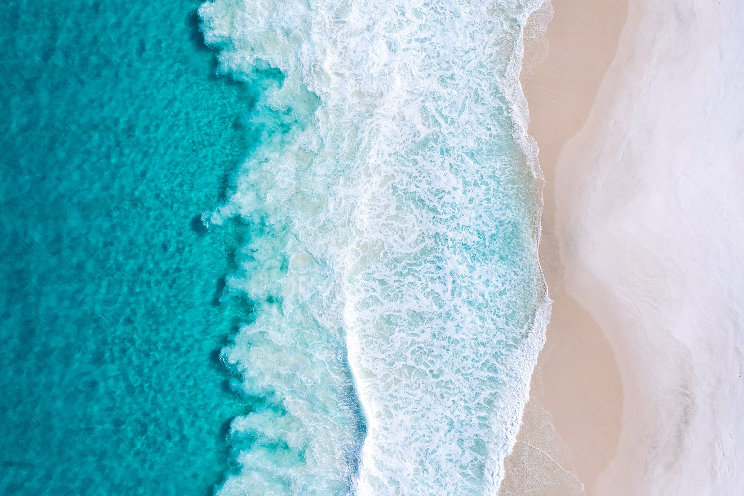 Turquoise ocean and white sand shoreline, abstract aerial patterns of waves and beach, aerial photography – Sean Scott Photography
