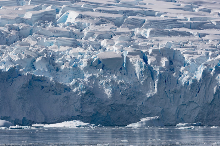 Antarctica, ocean texture with ice formations and deep blue water detail, fine art photography – Sean Scott Photography
